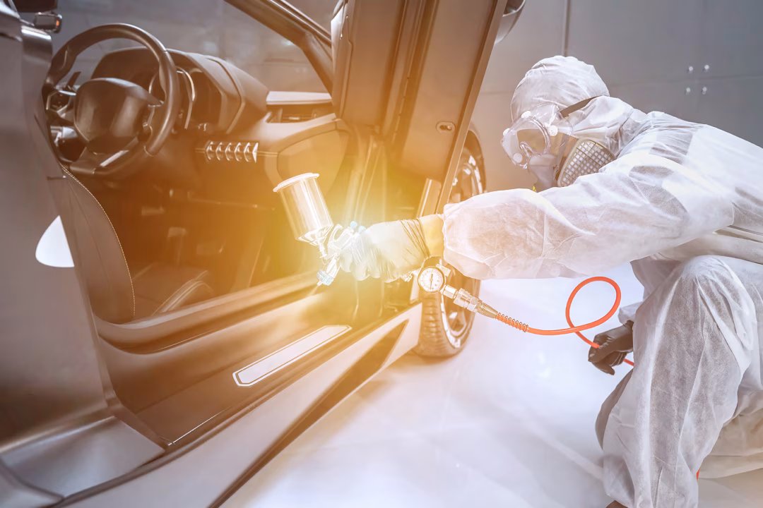 Professional automotive paint application following body repairs