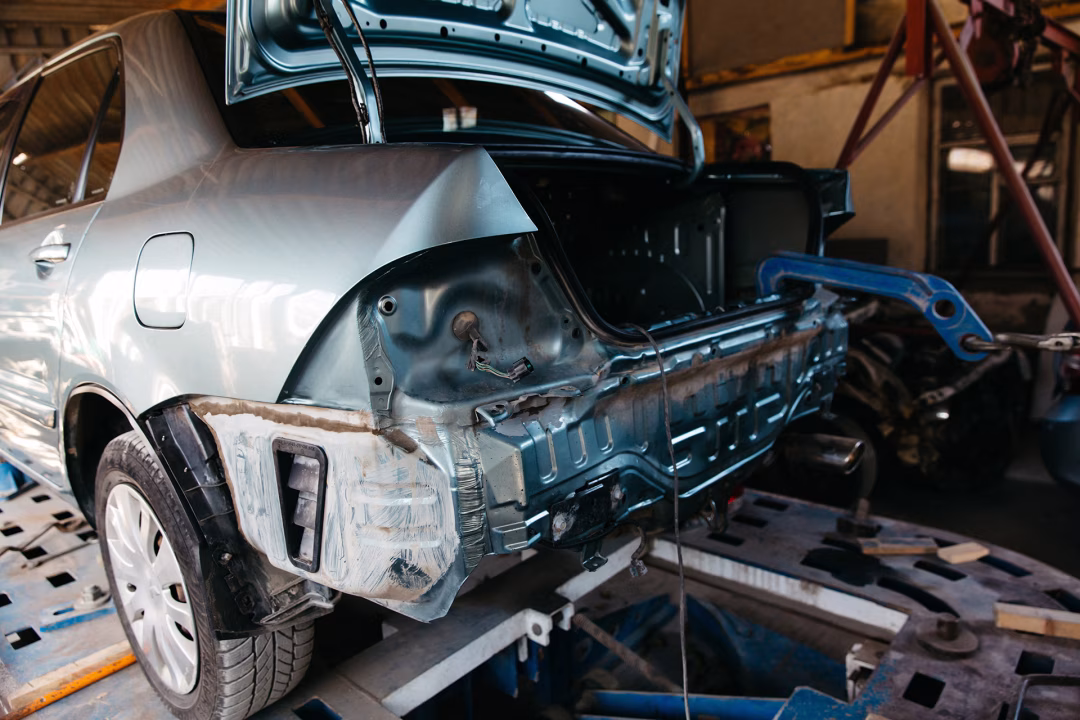 Auto body pulling work associated with collision damage repair